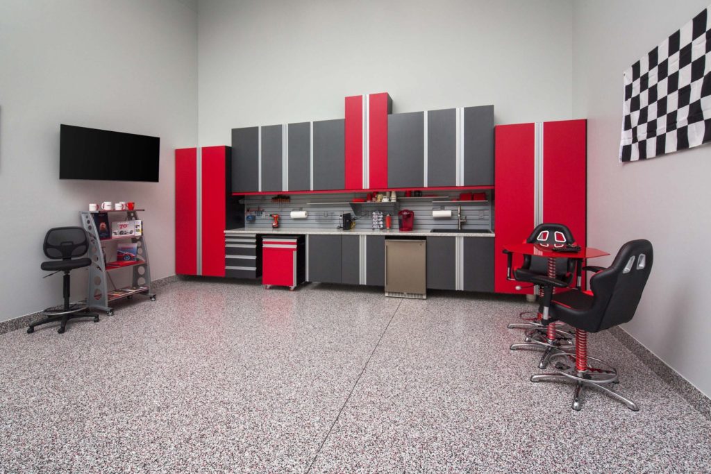 Garage with red and gray cabinets