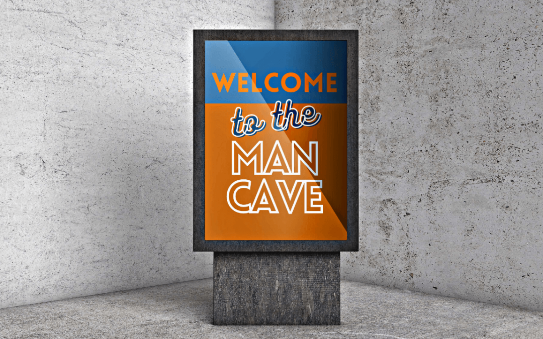 Blue and orange sign in front of concrete wall