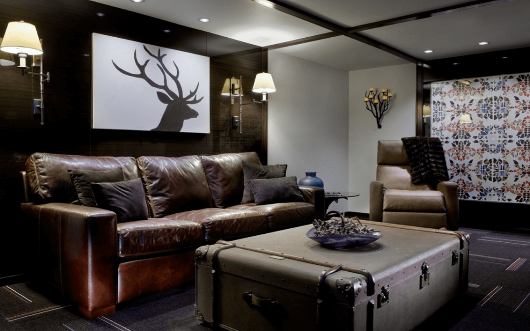 Dark room with couch and painting of deer