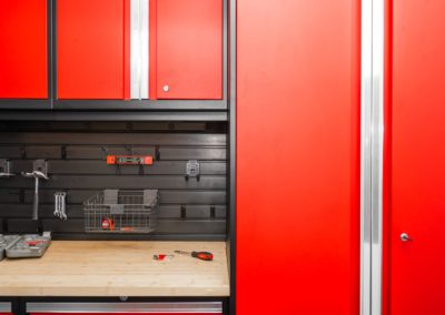 Garage with red cabinets