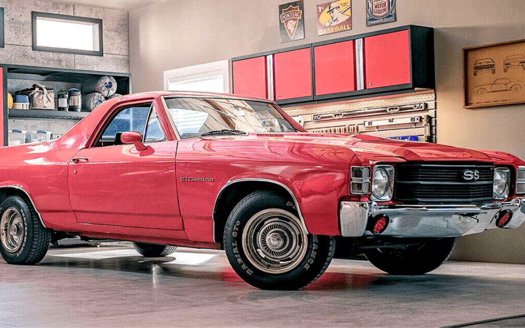 Red car on garage flooring