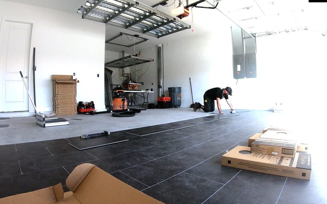 Man kneeling on garage floor tiles