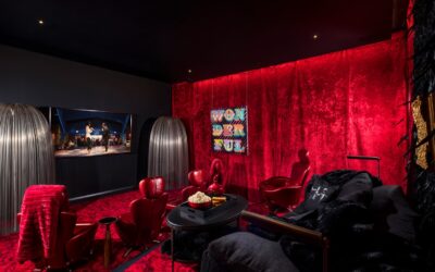 Small theater room with red wallcovering